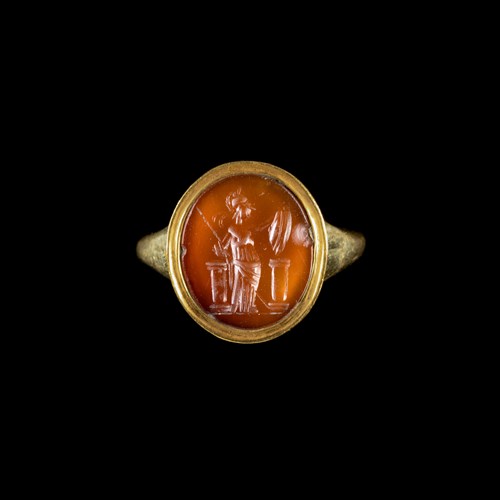 A modern gold ring set with a Roman carnelian intaglio. Athena.